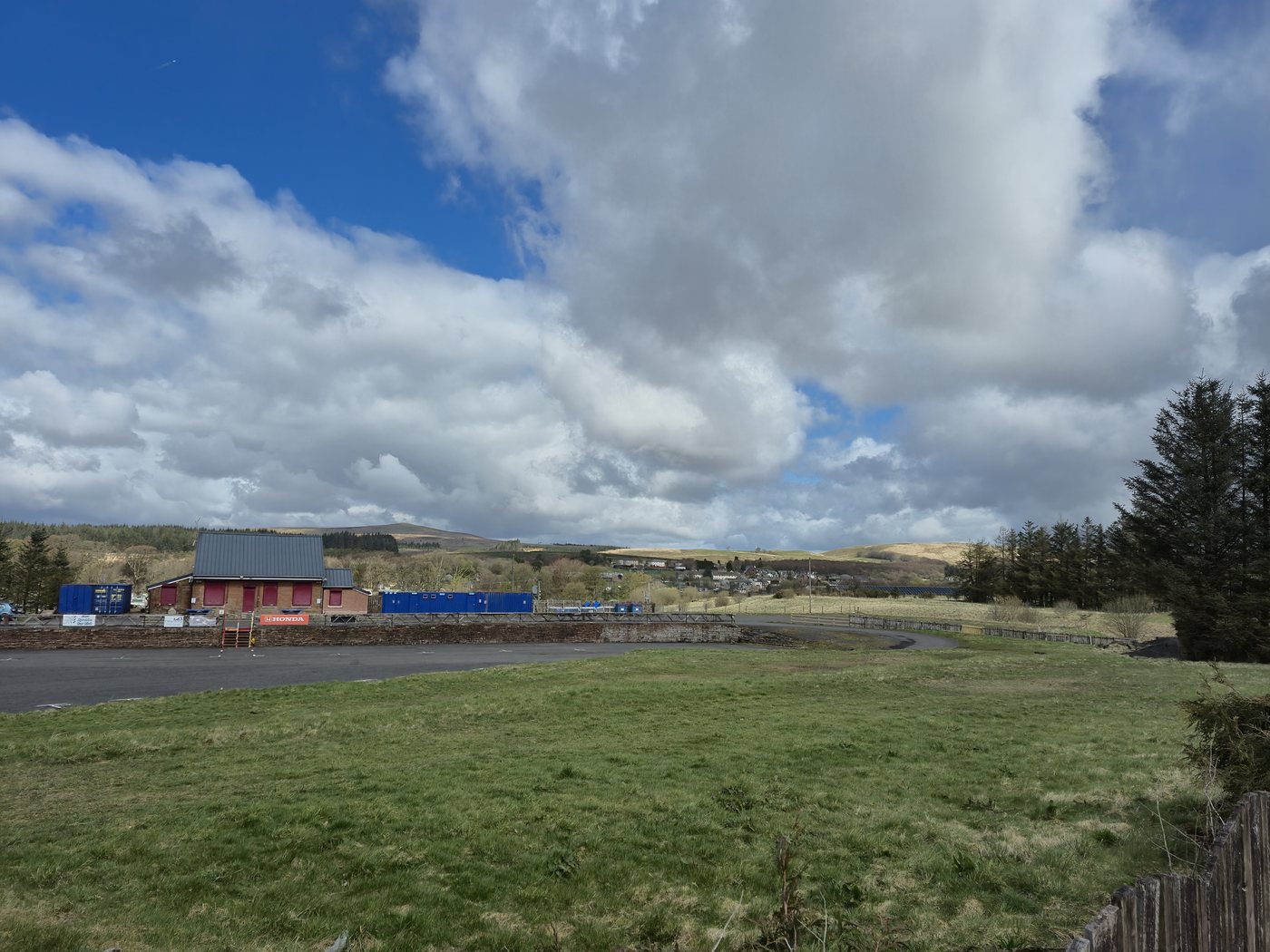Muirkirk seen from open ground with hills beyond the village.